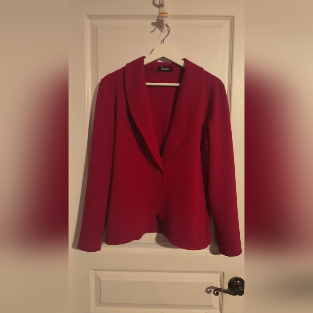 Gorgeous red blazer. Very light and pleasant to wear. Size large